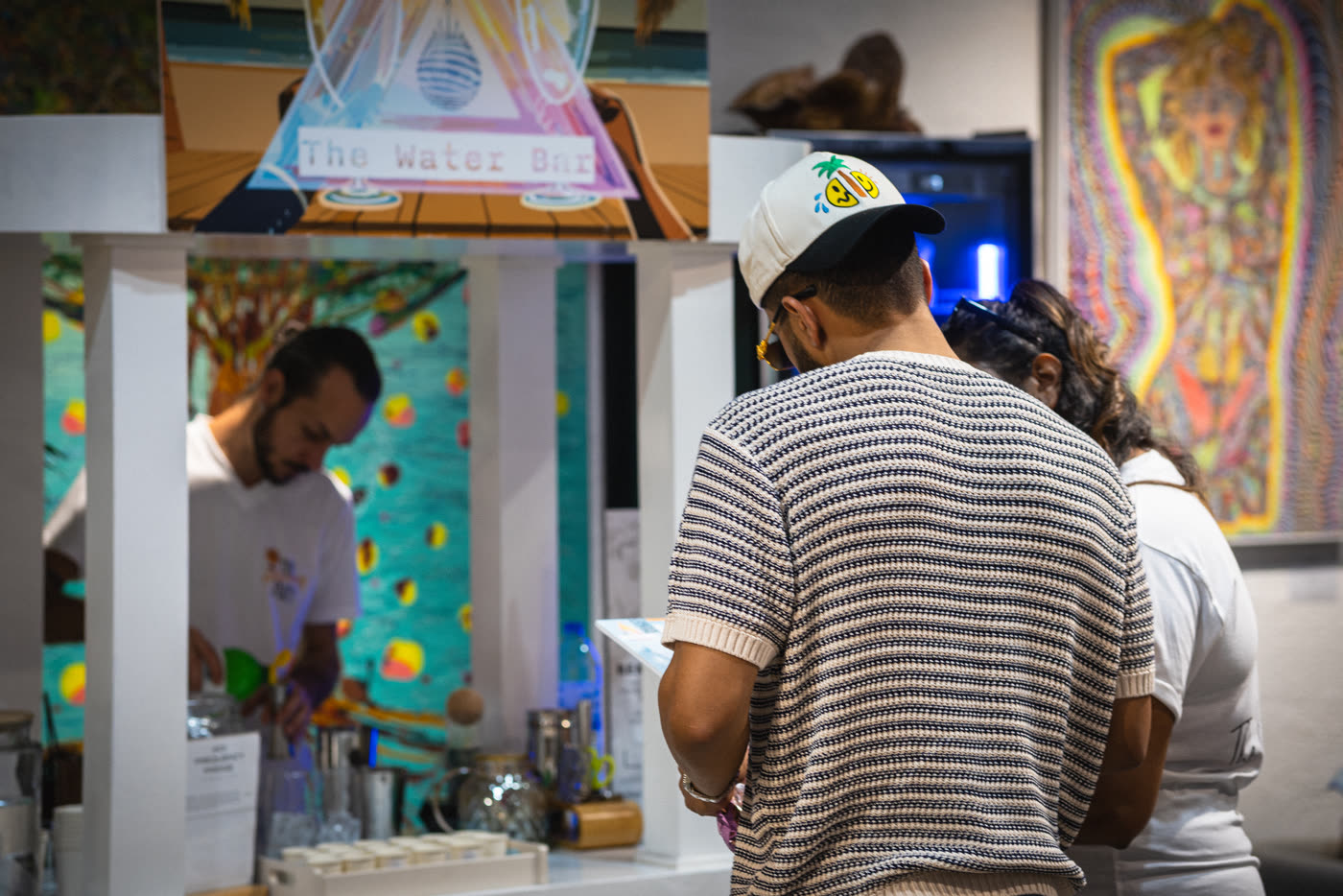 A bartender preparing a drink at The Water Bar